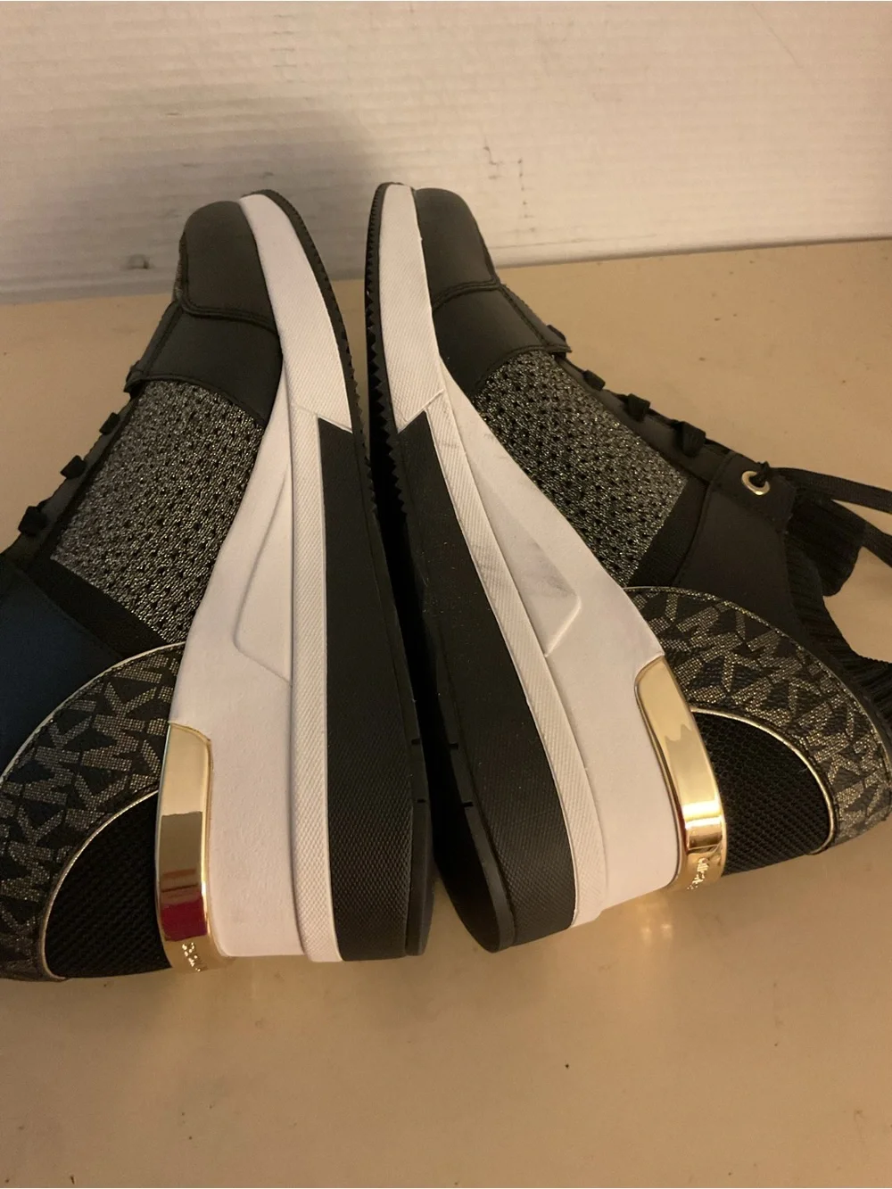 Michael Kors women black leather gold knit MK logo platform Georgie sneakers 11